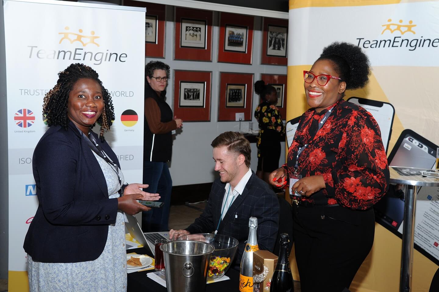 A delegate engages with exhibitors at the TeamEngine stand