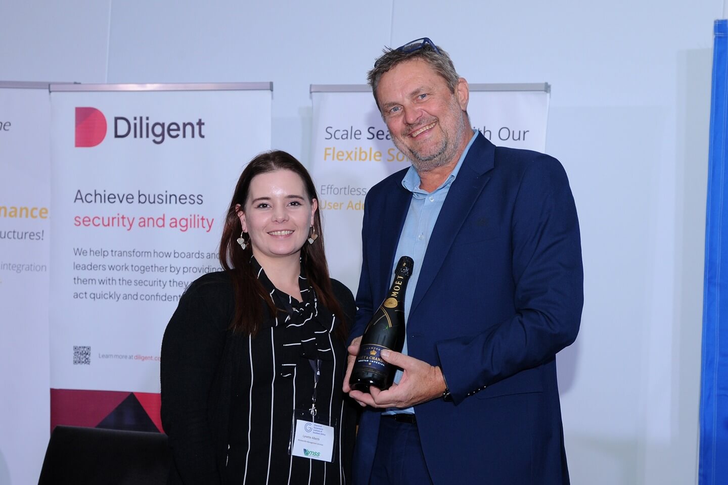 Lynnette Alberts from Stonehage Fleming Corporate Services winning a Bottle of Moet & Chandon