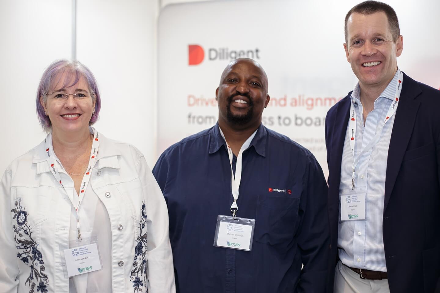 Jenny van Zyl, Michael Chihande and Alastair Hall from Diligent at their exhibition stand